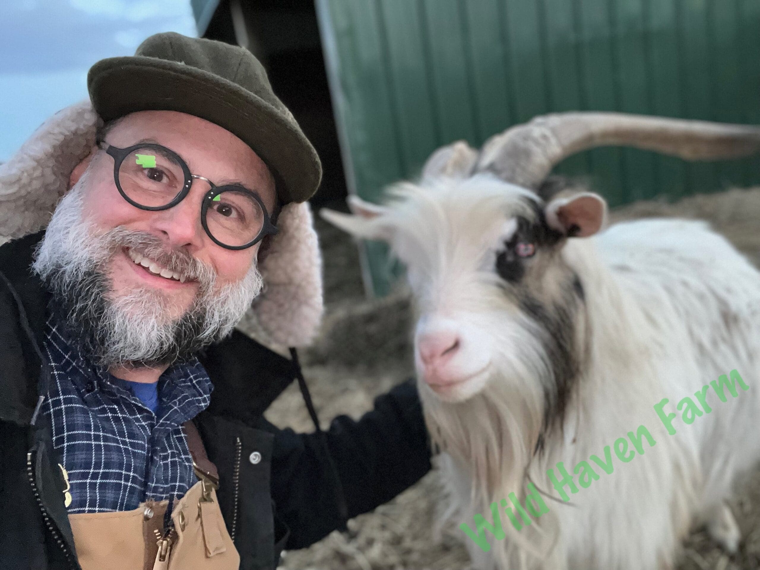 Man and goat at Wild Haven Farm